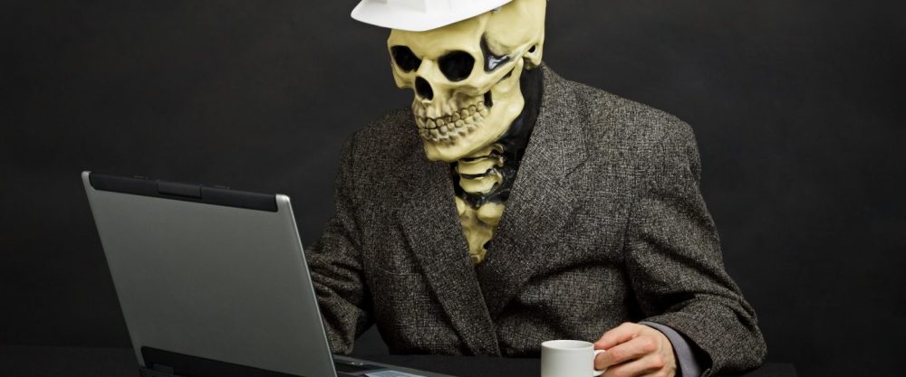 cropped-skeleton-at-computer-with-coffee.jpg